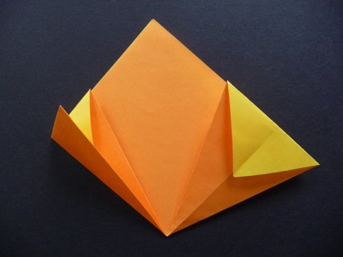 11. Valley fold one side in half, along the existing crease.